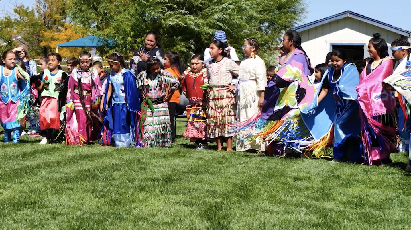  children dancing on lawn